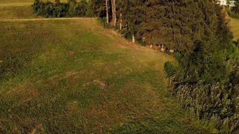 Top view from drone over green meadow and a house Stock Footage 112332683