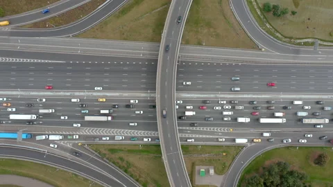 Top view from drone on overpass with road traffic. Cloudy weather. No timelapse. Stock Footage 139778719