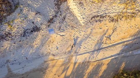 Top View Of Drone Pad As It Comes Into Land On Sandy Beach Stock Photos