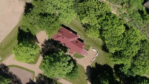 Top view drone rising and spinning over countryside house Stock Footage 331829281