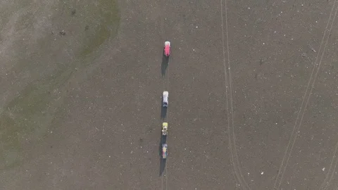 Top view. Drone shooting. Four 4WD cars driving on dirt road in Ukrainian Stock Footage 123836383