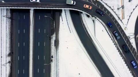 Top view drone shot of a big road junction, many cars moving on multi-lane road Stockbeeldmateriaal 155069236