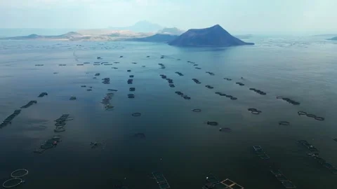 Top view drone shot of fish farms and volcanic scenery in Berinayan Talisay Видео 335432886