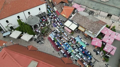 Top View Drone Shot of Many Men Perform Salaat Outside on the Prayerrugs Stock Footage 214313084