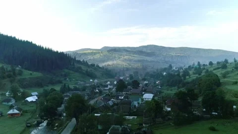 Top view from drone to small cozy mountain village Stock Footage 320244433
