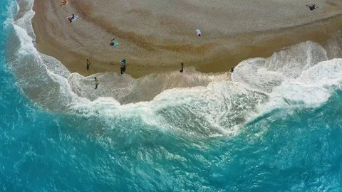 Top view from the drone on the surf and waves near the shore, turquoise sea with Stock Footage 118905956