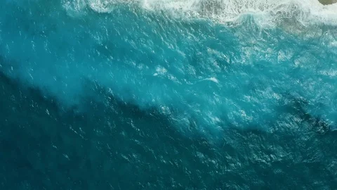 Top view from the drone on the surf and waves near the shore, turquoise sea with Stock-Footage 118916101