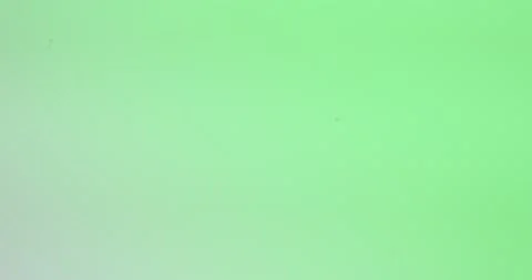 Top view of drop falls into water and diverging circles of water on green Stock Footage 153170313