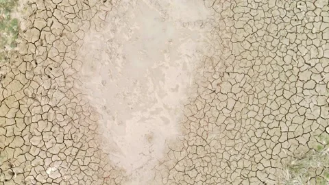 Top view of drought cracked soil, dry desert caused by climate change, Stock Footage 236983704