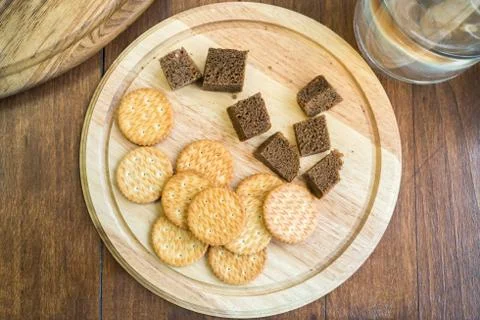 Top view of dry biscuits and corn bread as food sample. Biscuits and dark bre Stock Photos