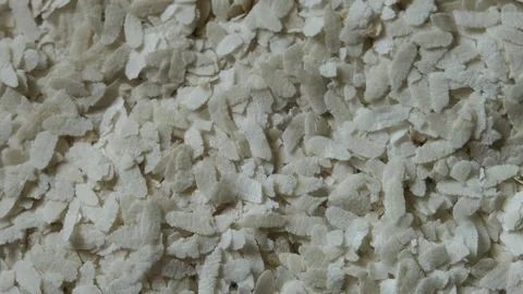 Top view of dry flattened rice flakes (Poha) Stock Footage 330658022