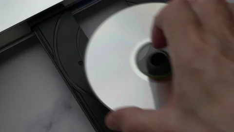 Top View DVD Disc, Eject Tray And Insert Disc In DVD-player. Man Of Hand Loads D 스톡 동영상 135602896