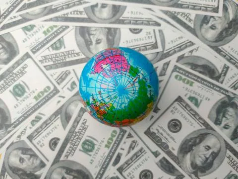Top view earth globe on a dollar banknotes Stock Photos