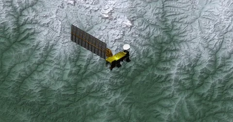 Top view of Earth-observing Aqua spacecraft in orbit above the Himalayas Stock Footage 63071986