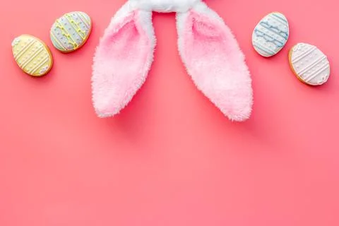 Top view of Easter bunny ears with eggs cookies, space for text Foto stock