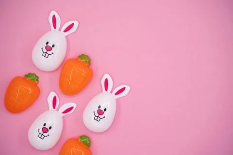 Top view of Easter bunny eggs and carrot decorations with copy space Stock Photos