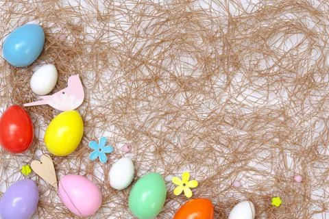 Top view of an Easter composition of painted eggs in bright juicy colors with Stock Photos