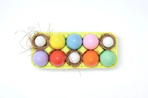 Top view of an Easter composition of painted eggs in bright juicy colors with Stock Photos
