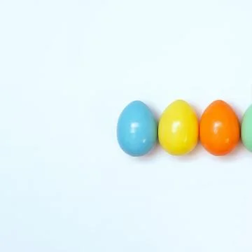 Top view of an Easter composition of painted eggs in bright juicy colors on a Stock Photos