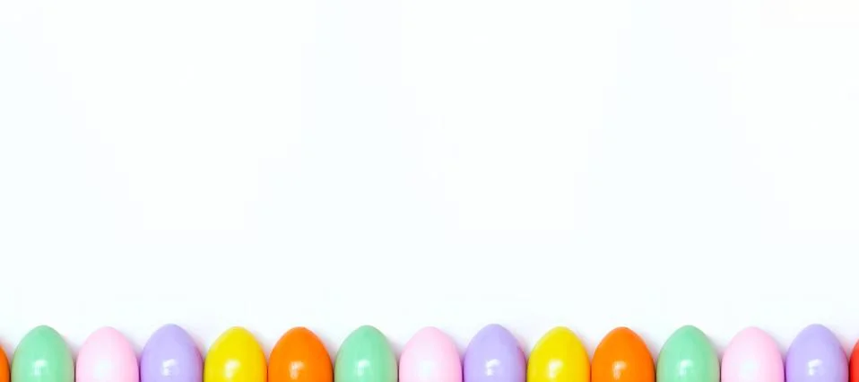 Top view of an Easter composition of painted eggs in bright juicy colors on a Stock Photos