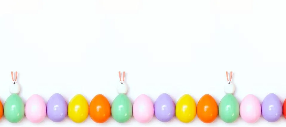 Top view of an Easter composition of painted eggs in bright juicy colors on a Stock Photos