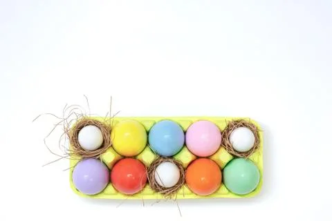 Top view of an Easter composition of painted eggs in bright juicy colors with Stock Photos