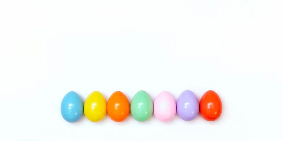 Top view of an Easter composition of painted eggs in bright juicy colors on a Stock Photos