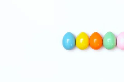 Top view of an Easter composition of painted eggs in bright juicy colors on a Stock Photos
