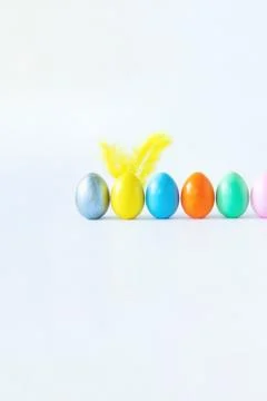 Top view of an easter composition of painted eggs in bright juicy colors on a Stock Photos