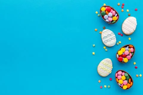 Top view of Easter cookies eggs and sweets. Space for text Stock Photos