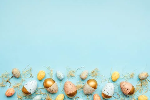 Top view of easter eggs colored with golden paint and differen colors. Blue.. Stock Photos
