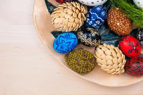 Top view of easter eggs in wooden bowl on wooden backgroud Stock Photos