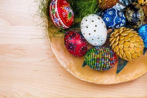 Top view of easter eggs in wooden bowl on wooden backgroud Stock Photos