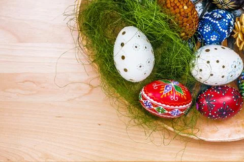 Top view of easter eggs in wooden bowl on wooden backgroud Stock Photos