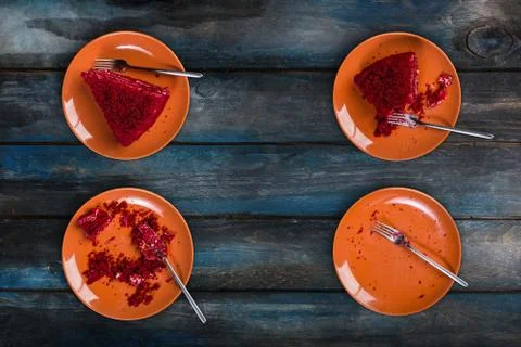Top View. Eating process of delicious Red velvet cake on a ceramic plate with a Stock Photos