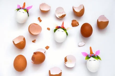 Top view egg shell and Easter unicorn eggs pattern on a white background Stock Photos
