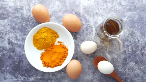 Top view of eggs and cooking ingredient on table Stock Footage 152463002