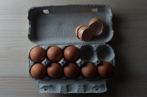 Top view - eggs cartoon box, close-up Stock Photos