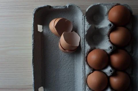 Top view - eggs cartoon box, close-up Stock Photos