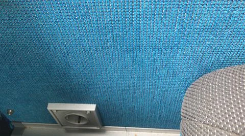Top view of electric socket in modern commercial bus with blue textured  olefin  Stock Photos