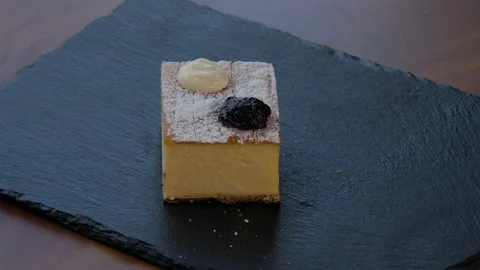 Top view of an elegant square piece of cheesecake Vidéo 168189909
