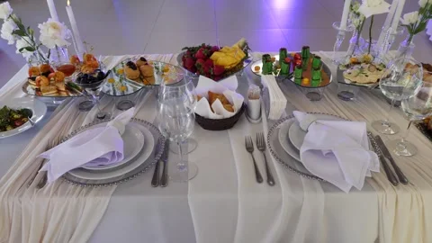 Top view of an elegant wedding banquet table setting with white drapery Stock Footage 340292710