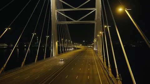 Top view elements metal structure modern cable stayed car bridge in night city Stock Photos