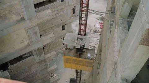 Top view of elevator heading up during construction process of multi level Stock Footage 307197499