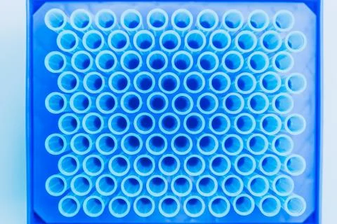 Top view of empte blue test tubes background. Science, chemistry, biology and Stock Photos