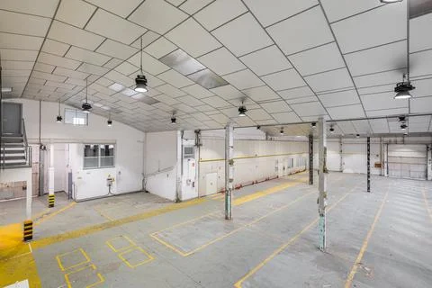 Top view of an empty auto repair shop or car park with natural light. Concept of Фото