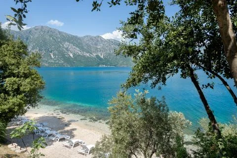 Top view of an empty beach with empty sun loungers, Montenegro Kotor bay Stock Photos