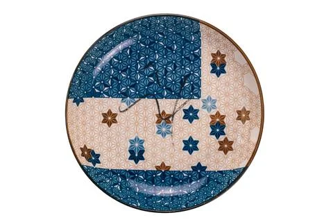 Top view of empty blue and brown star pattern dark edge ceramic plate. Foto stock