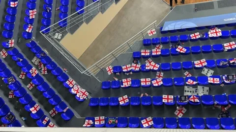 Top view of empty blue seats in stadium, Georgia flag with cross Stock Footage 293259663