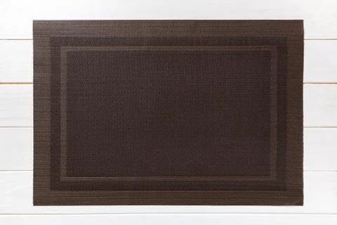 Top view of empty brown table napkin for dinner on wooden background with cop Stock Photos